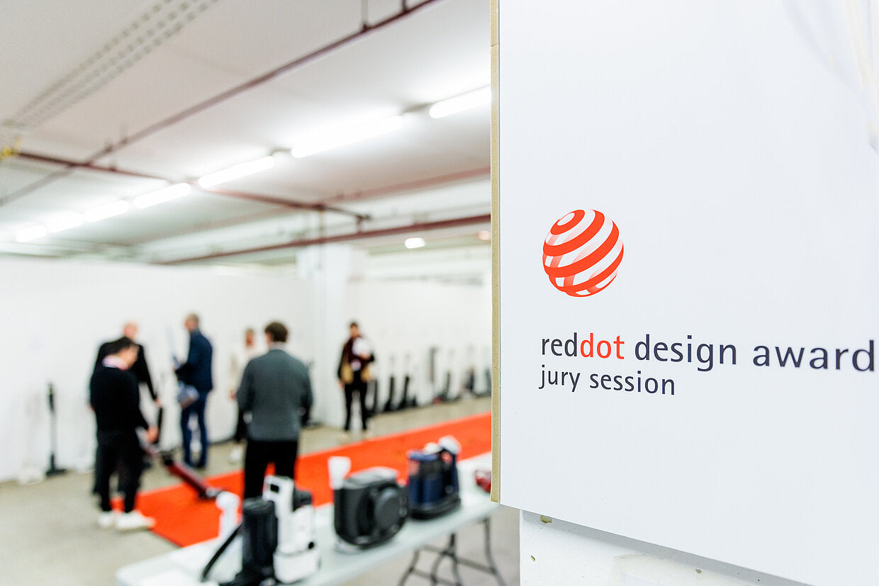 An image of the reddot jury as they look at different products.