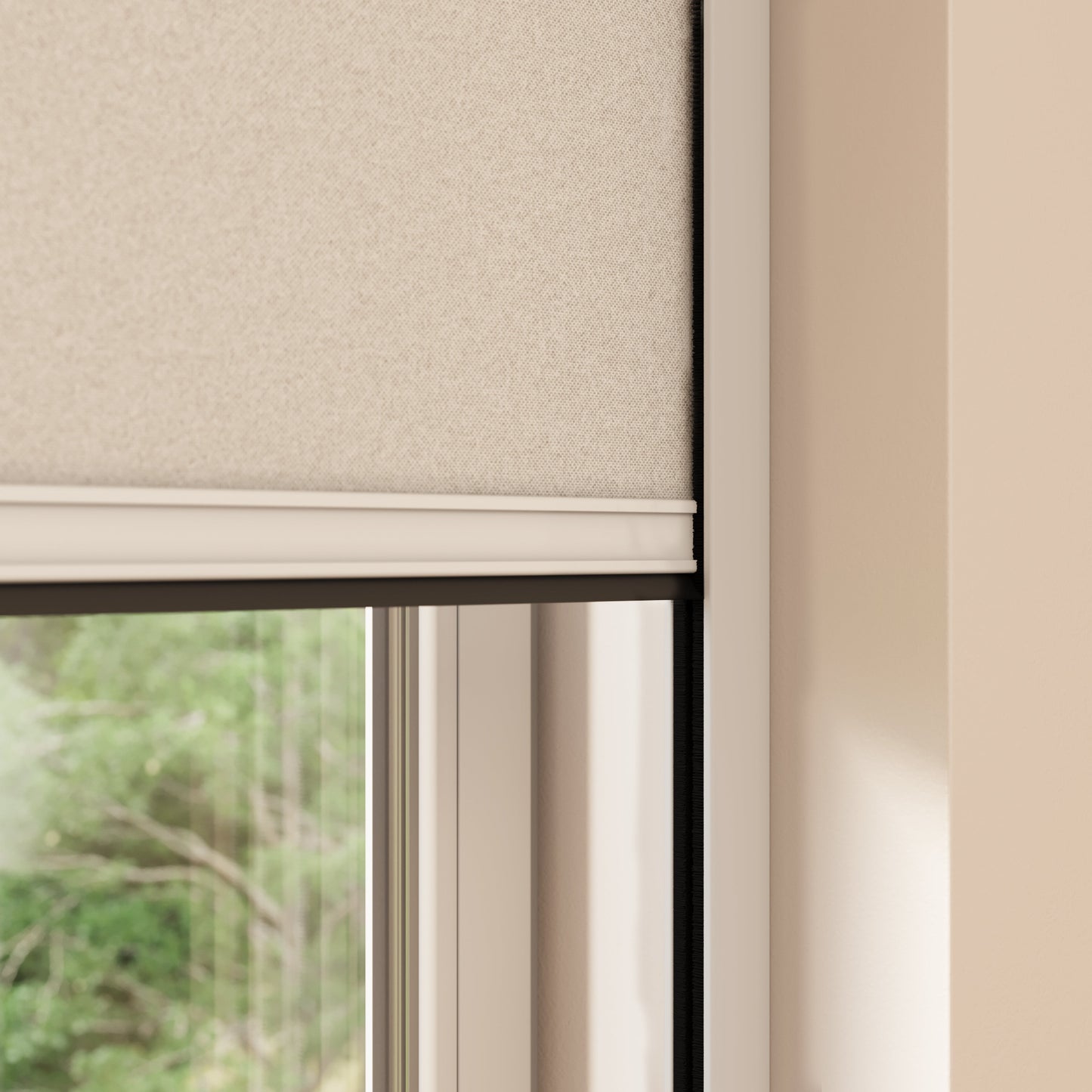 A close-up view of a partially lowered beige BlocOut blind inside a window frame. The window frame is white, and the wall surrounding it is painted in a light beige colour. Outside the window, there are blurred green trees visible.